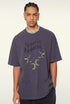 Close-up of purple "Terrible Beauty" tee and snake-heart design.