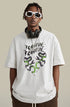 Close-up of white "Terrible Beauty" tee with bold graphic and headphones.