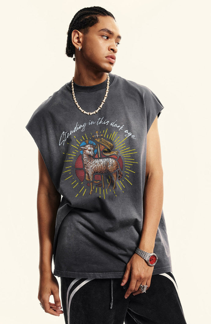 Model poses in dark gray ram tank, paired with striped pants and chain necklace