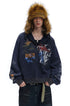 Front styling view of navy graphic zip-up hoodie with ribbed cuffs and hem.