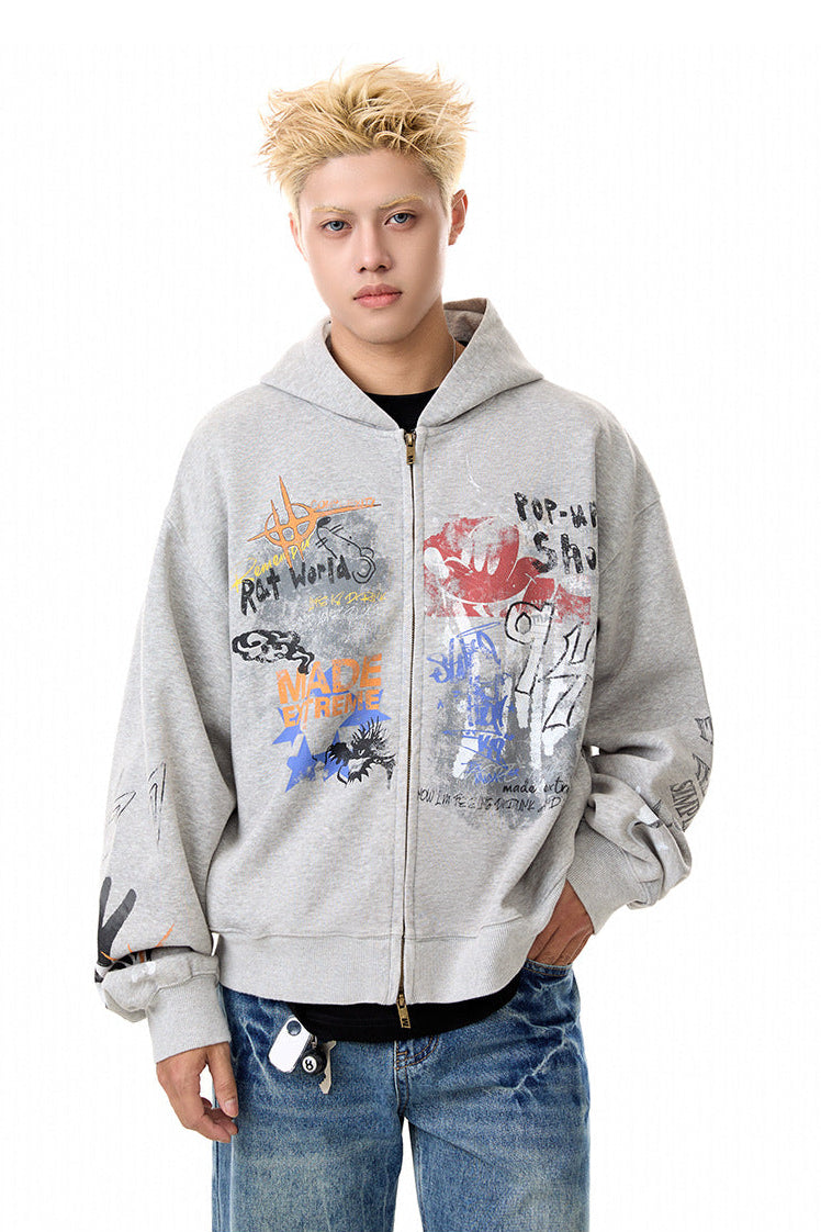 Close front view of gray zip-up hoodie showing multicolor graffiti graphics and long sleeves.