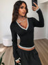 mirror selfie, black V neck long sleeve top with contrast trim, cropped slim fit