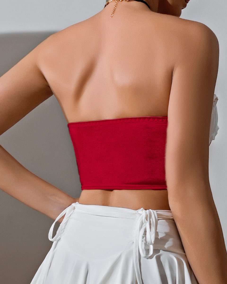 Back view of red velvet strapless corset with minimal stitching detail.