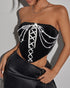 Full front view of black corset sparkling under direct light.