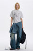 Heather gray vintage graphic T-shirt styled with wide-leg faded jeans