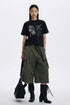 Black vintage graphic tee shown in a full-length streetwear outfit