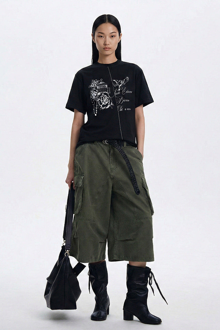 Black vintage graphic tee shown in a full-length streetwear outfit