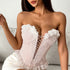 Woman in pink floral lace corset with deep V neckline and lace-up front.