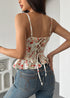 Back view of lace-up rose corset top with ruffle hem and adjustable straps.