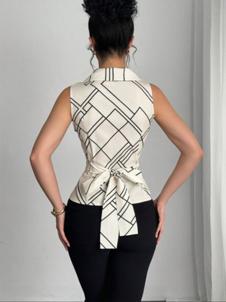 	Back view of sleeveless V neck blouse with waist tie and geometric print