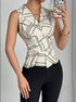 Close-up mirror selfie of V neck geometric blouse with tie waist