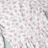 Seam stitching detail on floral print mini dress with gathered waist.