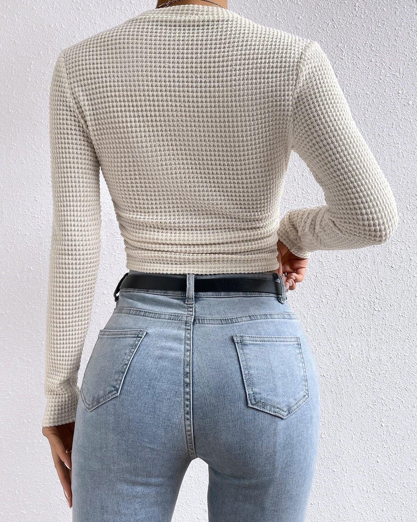 back view showing slim fit on cream waffle knit long sleeve crop top