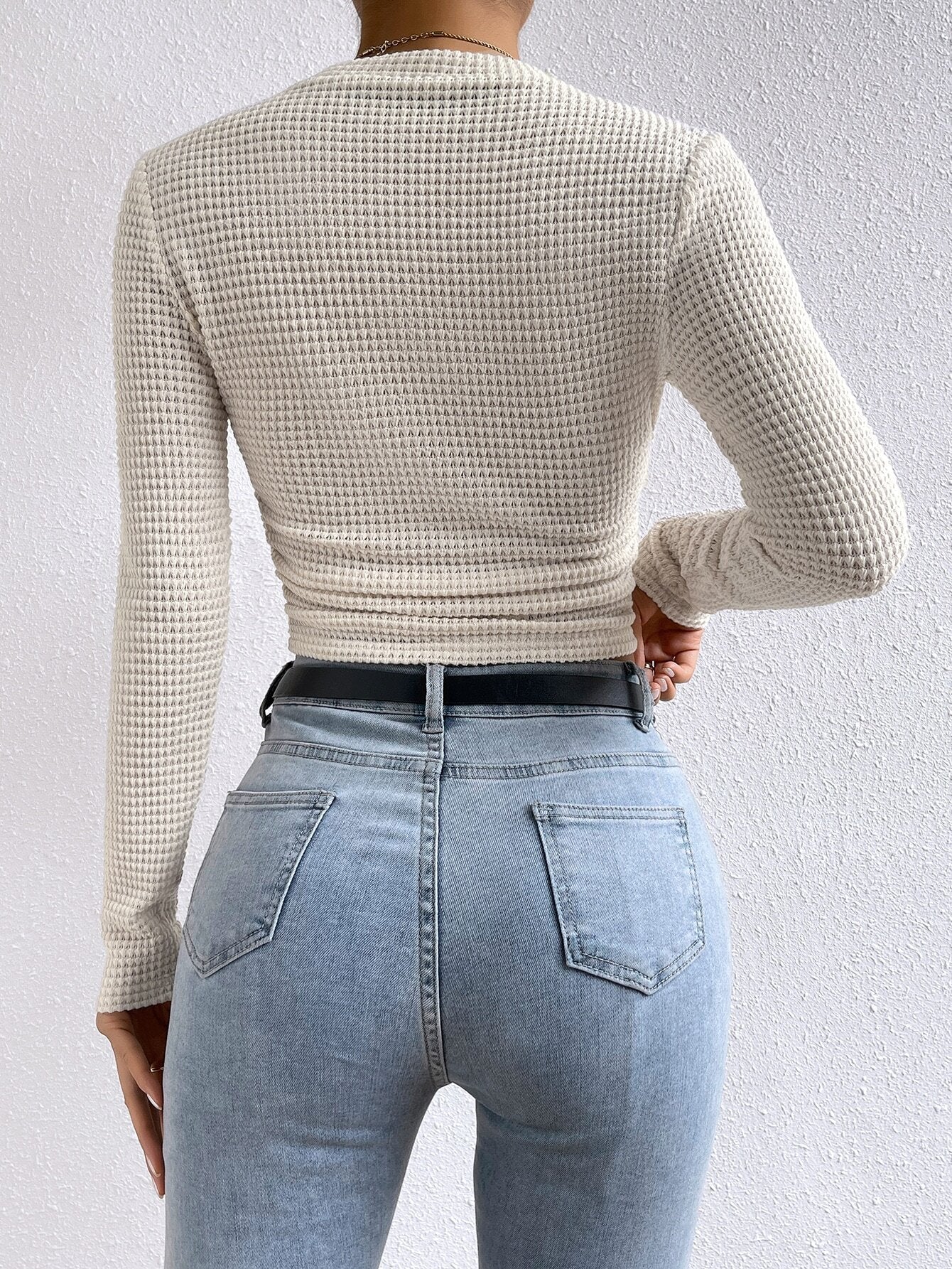 back view showing slim fit on cream waffle knit long sleeve crop top