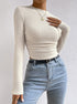 close front angle highlighting waffle texture and fitted waist on cream crop top