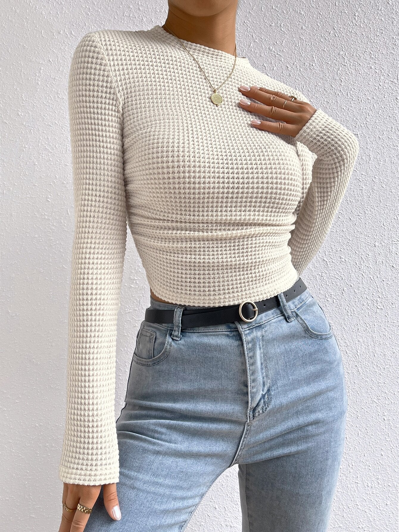 close front angle highlighting waffle texture and fitted waist on cream crop top