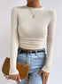 cream waffle knit long sleeve crop top, slim fit crewneck, front view with jeans
