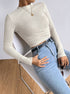 eated pose, slim fit cream waffle knit long sleeve crop top styled with denim
