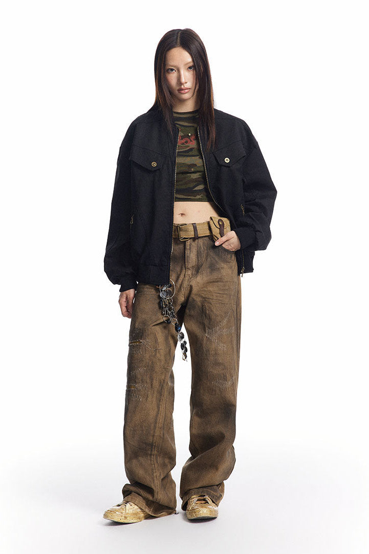 Full-length styling of black washed jacket with cropped striped top and wide pants