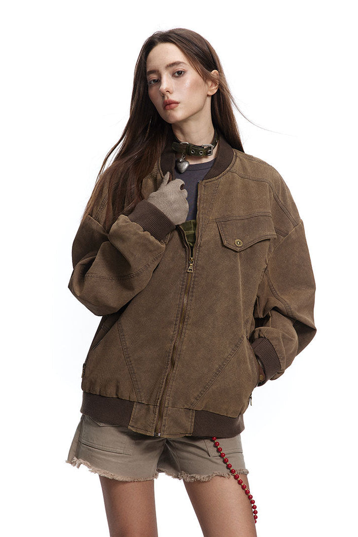 Three-quarter front view of brown oversized jacket with ribbed collar and cuffs