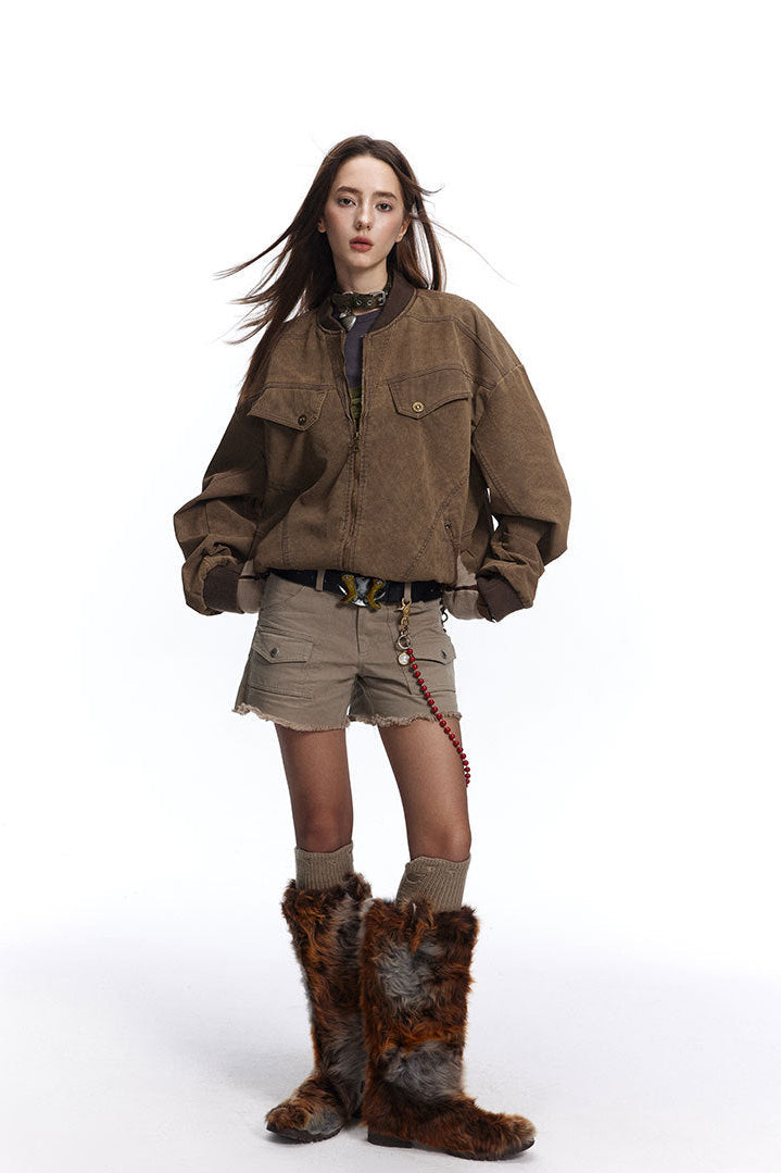 Full-length styling of brown washed Harrington jacket with shorts and tall boots