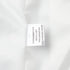 White blazer fabric composition and care label