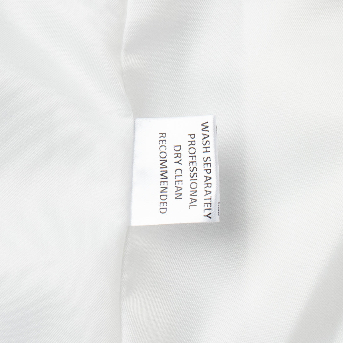 White blazer fabric composition and care label