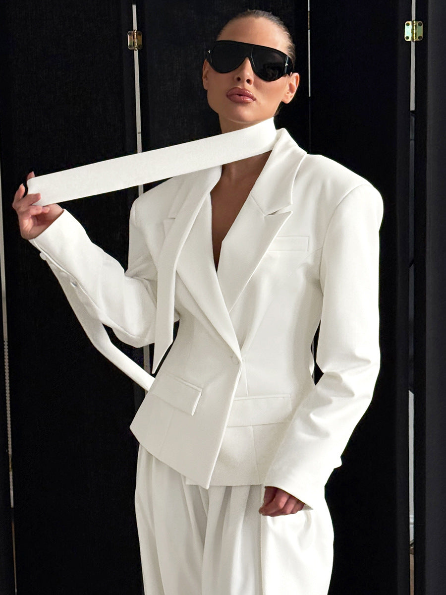 Close-up of white blazer lapel and smooth woven texture