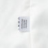 Inner lining and tag of women’s white blazer