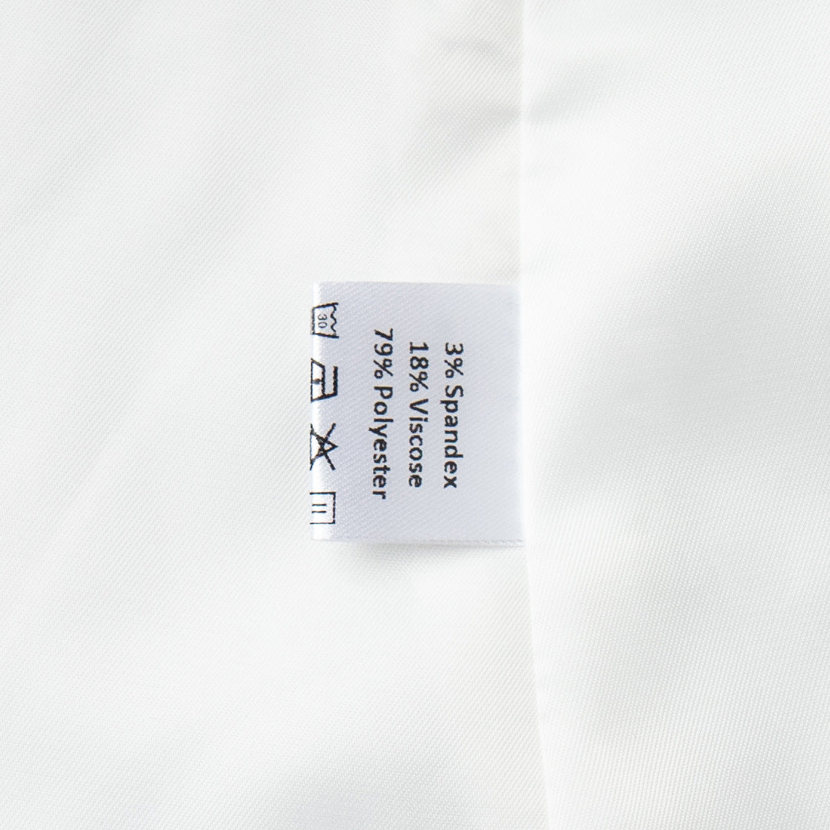 Inner lining and tag of women’s white blazer