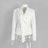 White blazer displayed on mannequin with structured shoulders