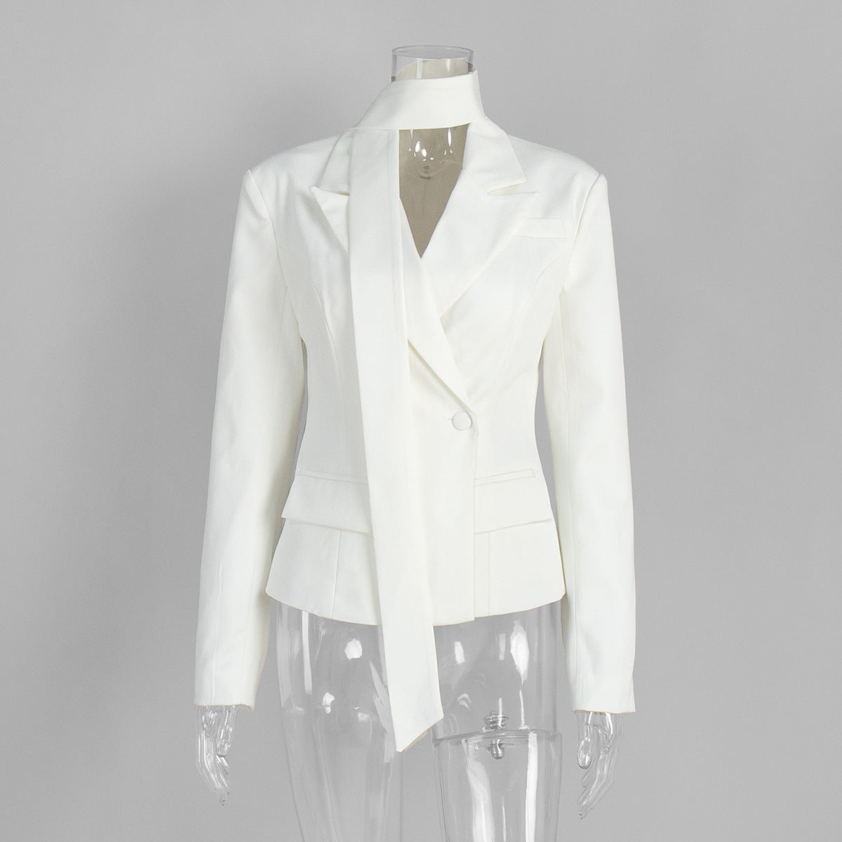 White blazer displayed on mannequin with structured shoulders