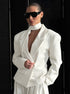 Minimalist white blazer outfit with modern scarf collar