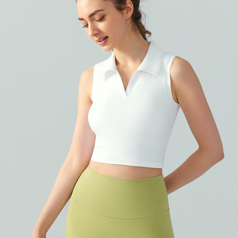 Women’s sleeveless polo golf top in white with cropped fit and V-neck collar, angled front view