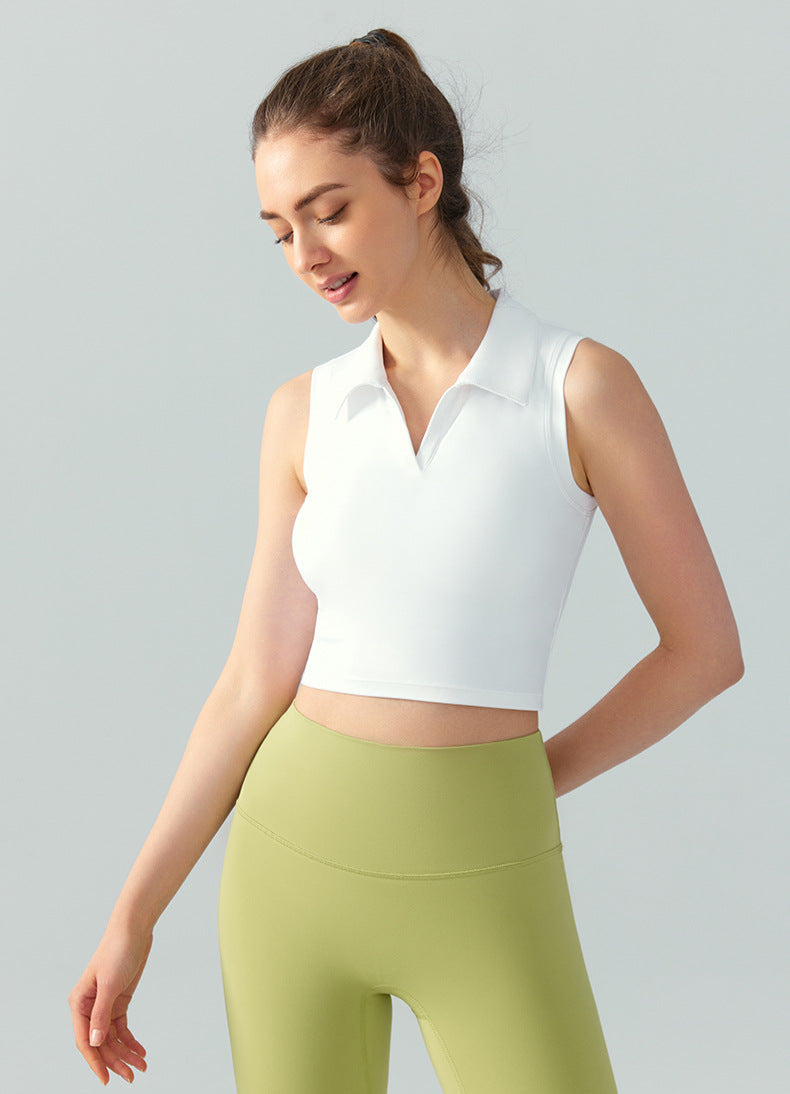 Women’s sleeveless polo golf top in white with cropped fit and V-neck collar, angled front view
