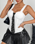 Woman wearing white structured bustier and black mini tie, accessorized with leather bag and bangles.