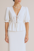 White blouse with puff sleeves skirt set on a beige background