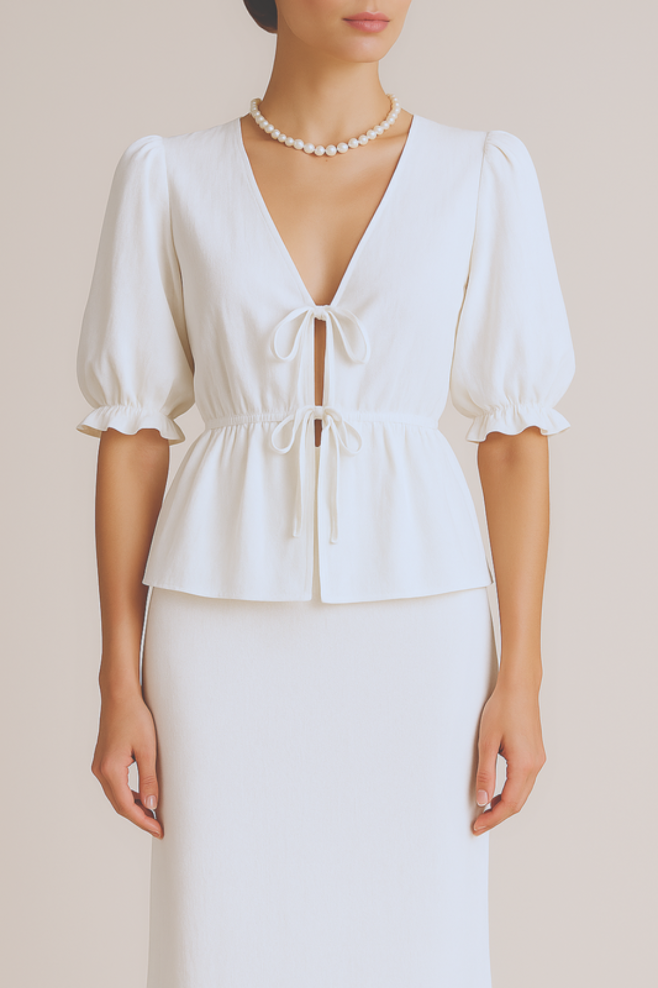 White blouse with puff sleeves skirt set on a beige background