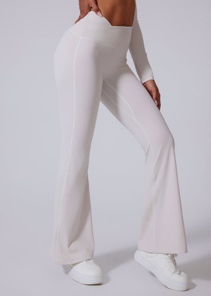 Side angle of white high waisted wide leg yoga pants
