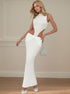 White hollow-out dress with high neck, side cut-outs, and long skirt shown in angled standing pose.