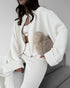 White knit lounge set styled with wide leg pants indoors
