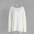 Front view of white knit sweater with long sleeves