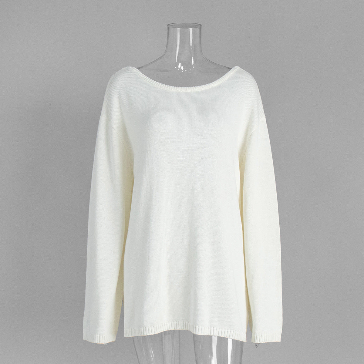 Front view of white knit sweater with long sleeves