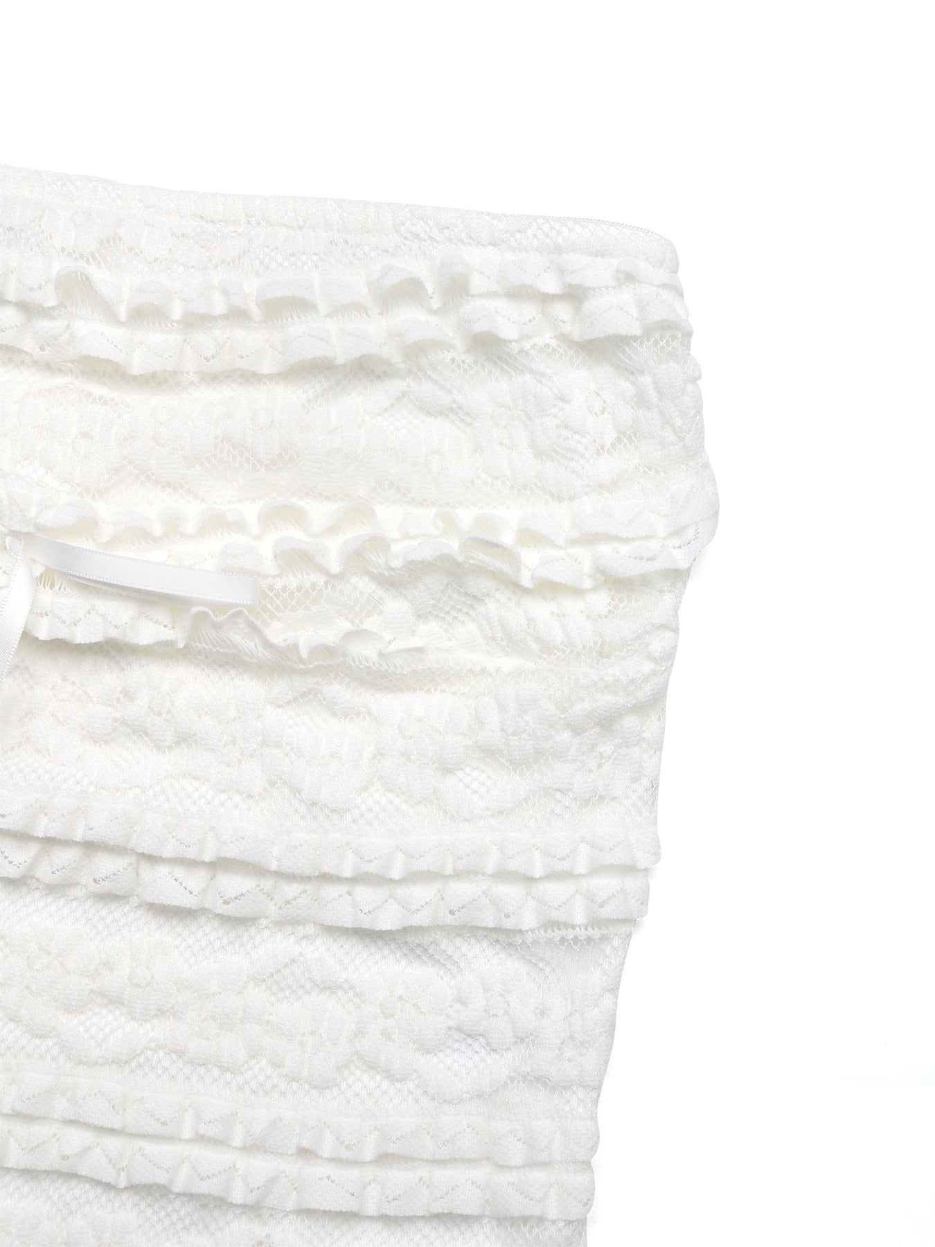Angled view of upper portion of lace tube top highlighting textures.