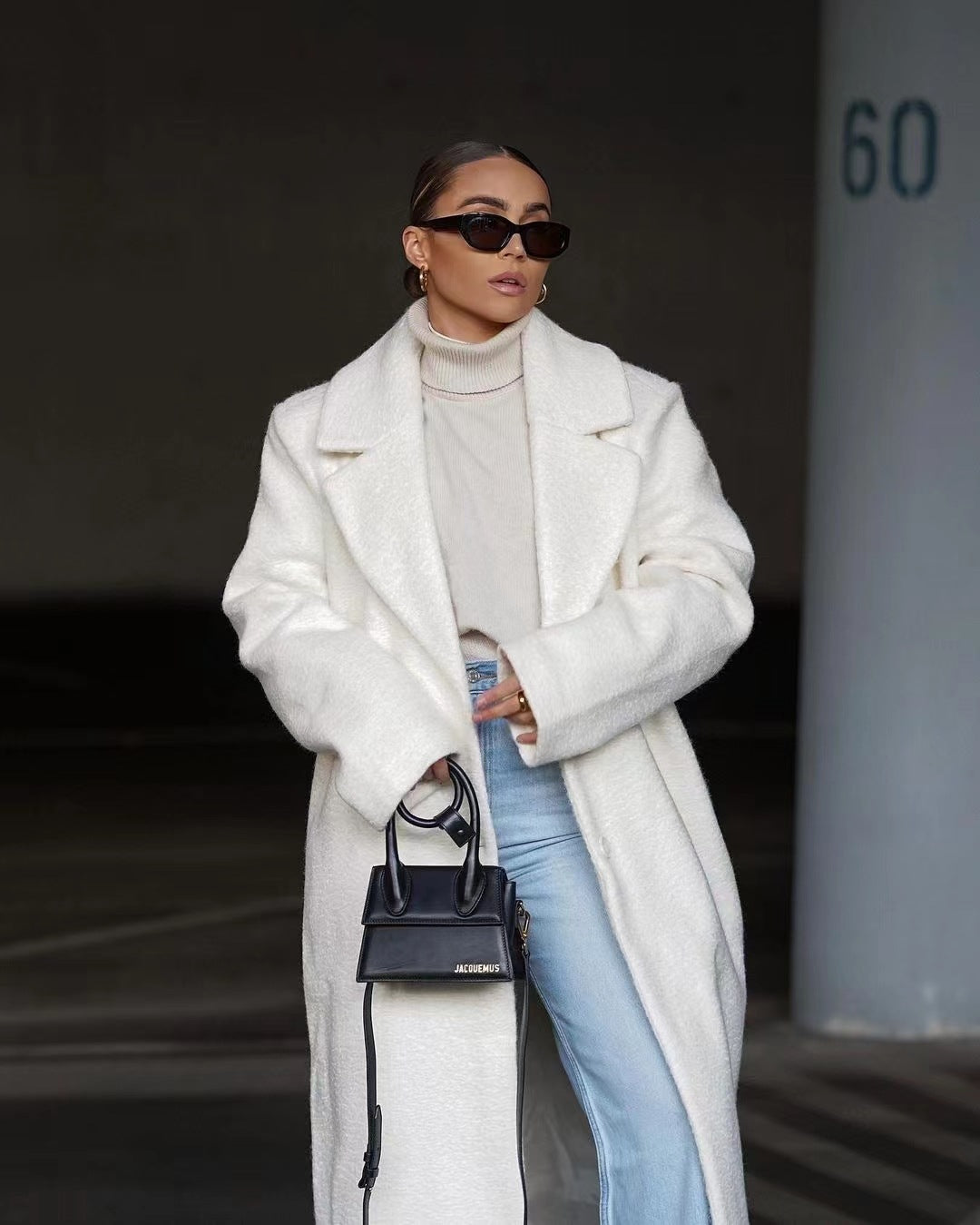 White long teddy coat with sunglasses, relaxed winter styling