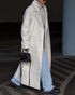 White long teddy lapel coat styled with denim and boots, walking