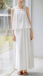White two piece outfit with floral hem and airy top