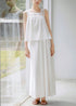 White two piece outfit with floral hem and airy top