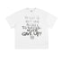 Flat-lay of white oversized T-shirt with inspirational chalk-style text: "There is but one secret to success: never give up!"