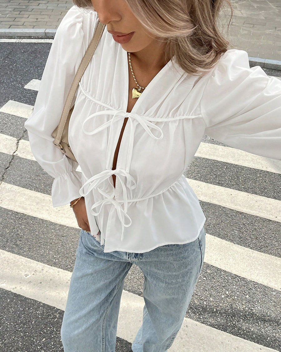 White puff sleeve blouse with tie front and V-neck for women